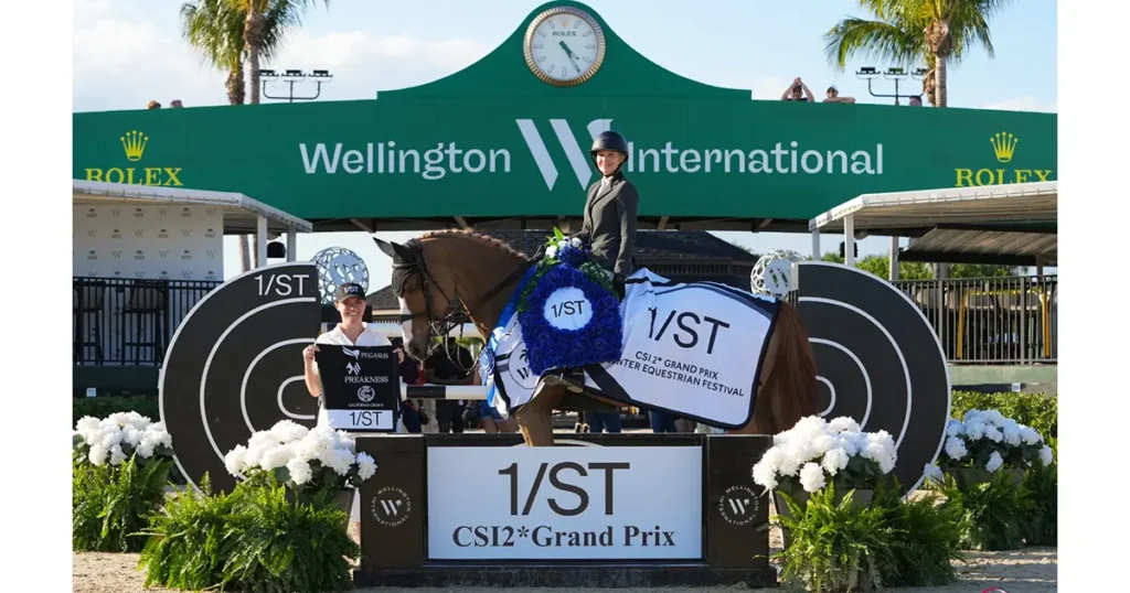 Marilyn Little & Olympic van de Noordheuevel are presented as winners of the $62,500 1/ST CSI2* Grand Prix by Ainsley Hayes, 1/ST Equestrian. Photo © Sportfot