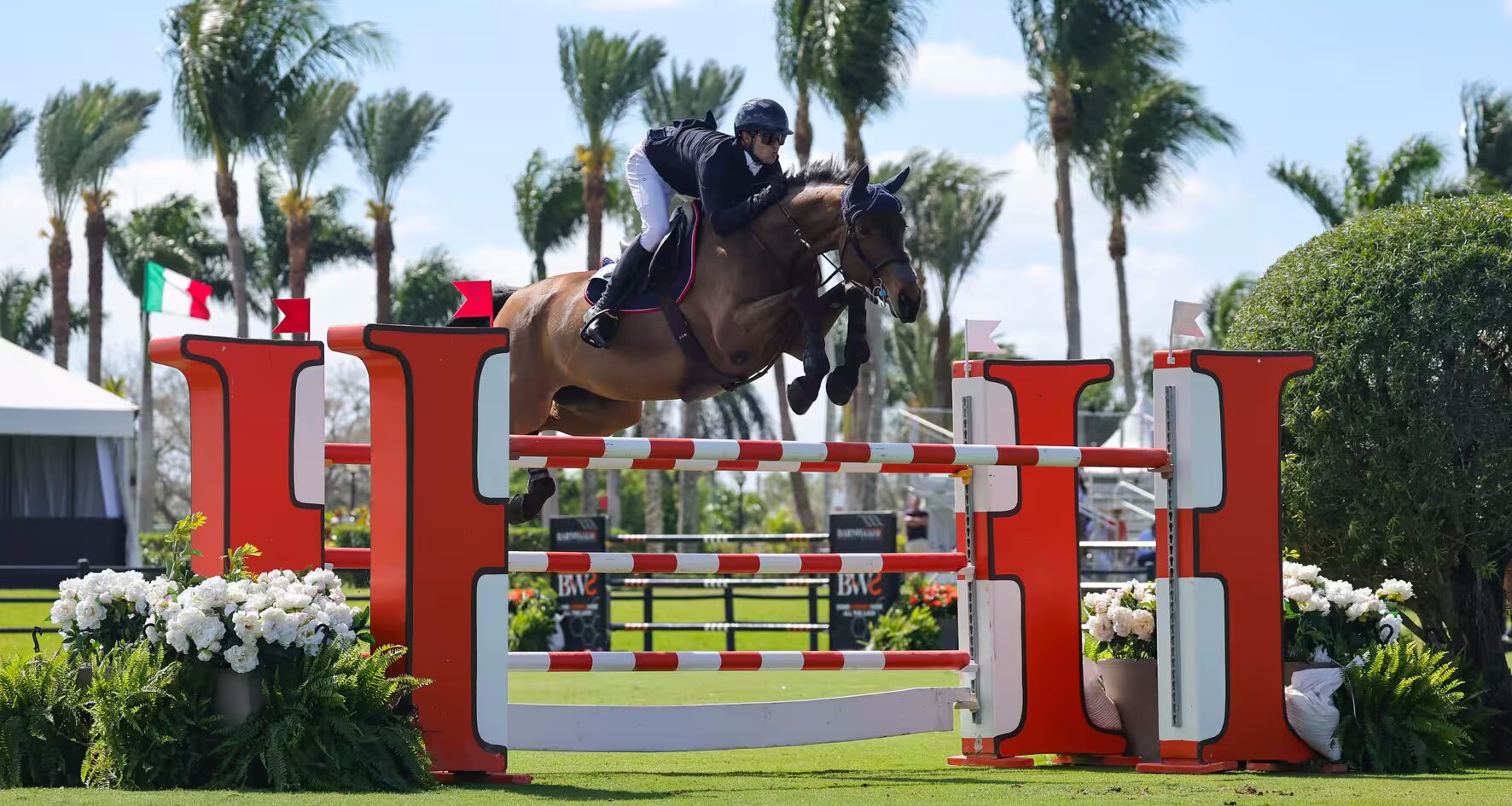Luis Fernando Larrazabal & Scarlett du Sart Z are presented as winners of the $32,000 Hermès CSI3* 1.50m Classic by Leah Rogers Meierfeld, Equestrian Account Executive for Hermès. Photo ©Sportfot