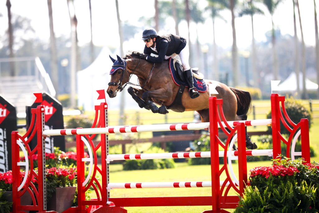 Luiz Fernando Larrazabal riding "Belle De Muze" jumping on the field.