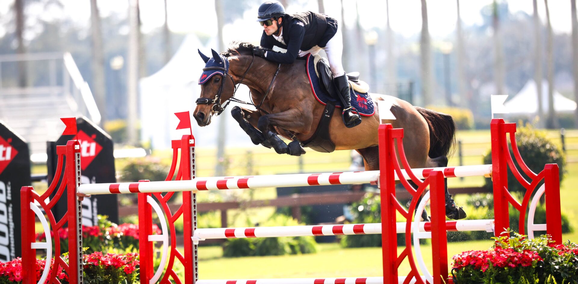 Luiz Fernando Larrazabal riding "Belle De Muze" jumping on the field.