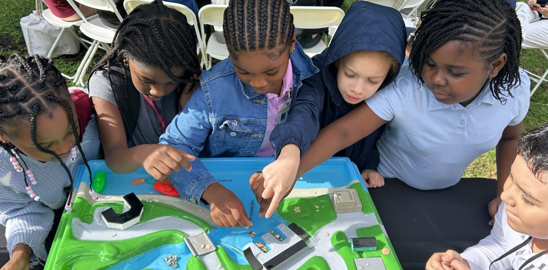 kids playing a board game outside