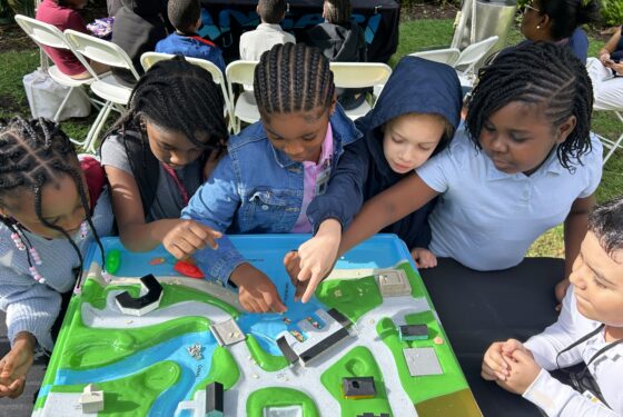 kids playing a board game outside