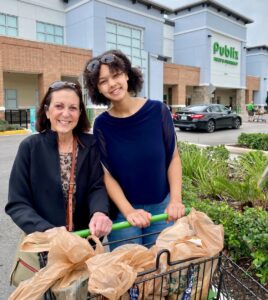 two women with groceries